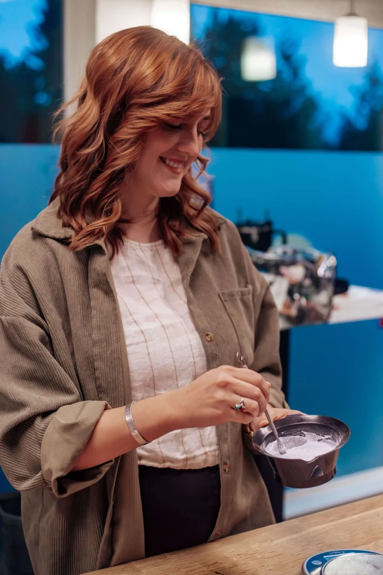 delaney dip hair stylist mixing color in a bowl